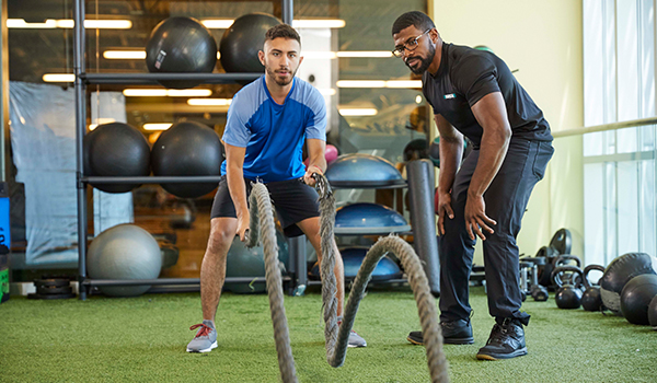 Male Personal Trainer with client